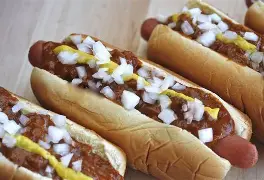 Classic coney dog topped with mustard, onions, and chili